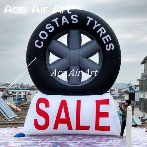 Hot sale custom logo giant advertising inflatable tire balloon IN 15 FT tall with fan for sale