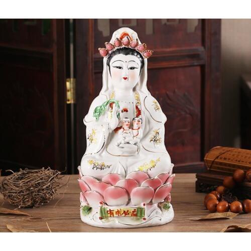 Buddhists Worship Guanyin Bodhisattva As A Gift for Their Children. Hand-painted Pottery of Nanhai Guanyin Buddha Statue