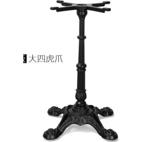 Western restaurant. The table legs. The legs. Support.. Wrought iron table leg