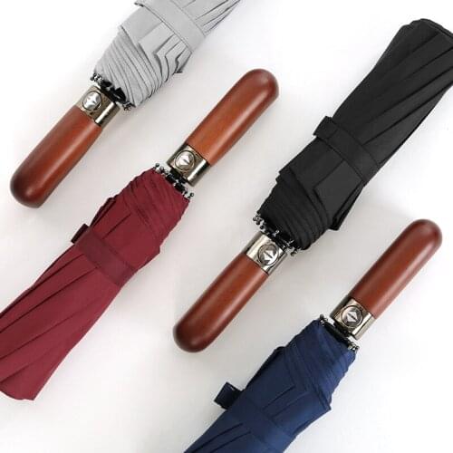 Fully automatic 10 bone windproof solid wood handle Rainy Day umbrella three fold mens business umbrella
