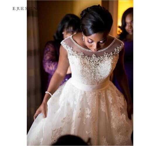 E JUE SHUNG African Wedding Dresses Cap sleeves White Lace Appliques Luxury Bride Dresses crystals A Line Bridal Wedding Gowns