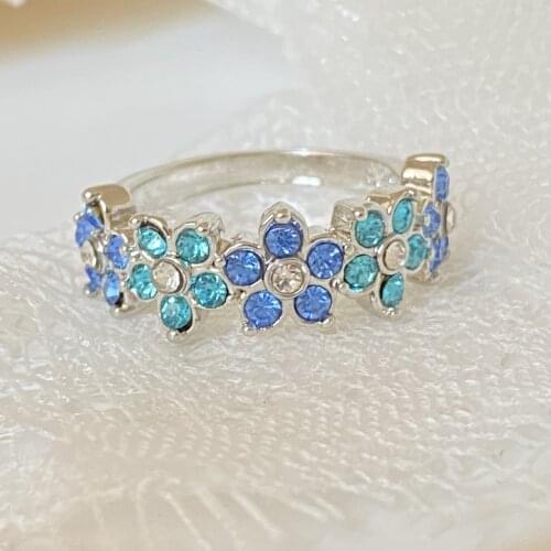 New Fashion Exquisite Blue Zircon Plum Blossom Infinite Flower Crystal Ring O/L Style Jewelry Womens Wedding Anniversary Gift