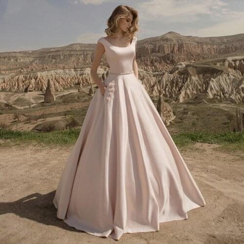 A-line Nude Champagne Wedding Dresses Open Back Beach Bridal Gowns Sleeveless Outdoor Party Dress With Belt Flower Pockets