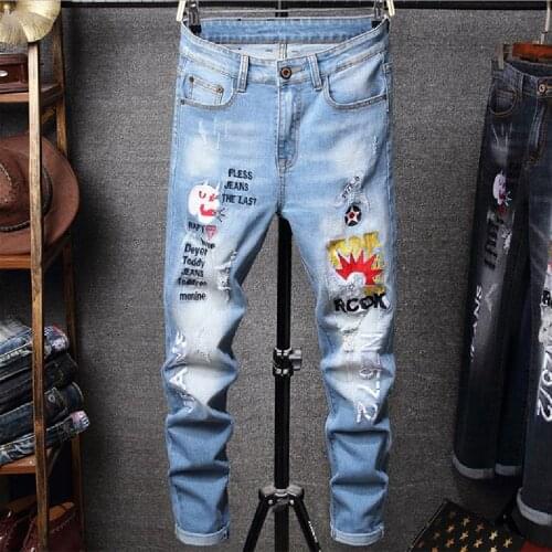 Tide male embroidery broken hole jeans European and American fashion personality embroidery small straight pants retro jeans