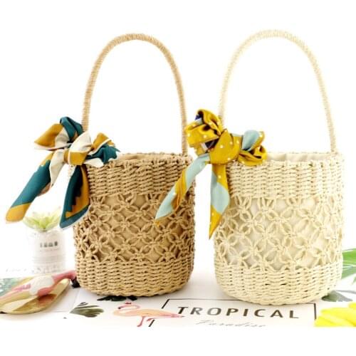 Simple and fashionable drawstring woven handbags silk scarf straw woven beach travel handbag Mori series barrel-shaped woven bag