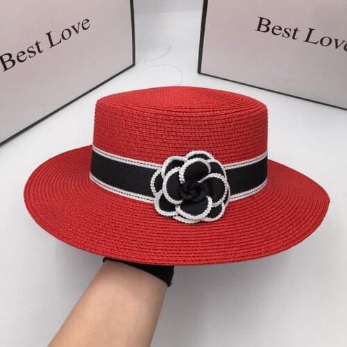 Summer new French Hepburn red flat women 's straw hat sun hat flower wide-brim sunscreen tide