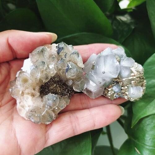 Natural mineral crystal chalcopyrite and calcite mineral specimens are displayed in a home decoration display displaying chakra