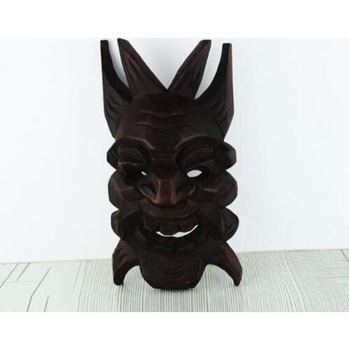 The evil wood carving mask of cultural art and craft sculpture. The best of Halloween