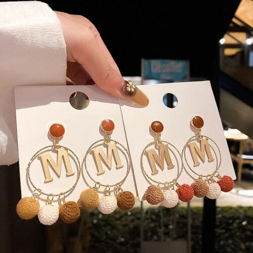 Retro M letter European and American circle autumn and winter fur ball earrings net red wild creative earrings