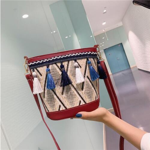 Womens bags Female bag Summer small bag girl grass woven bag tassel Bucket Bag Beach bag messenger bag ladies bag