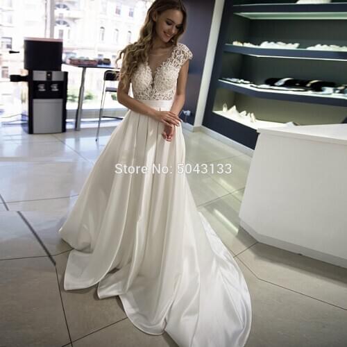 Elegant Satin Wedding Dresses 2020 Cap Sleeve Scoop Wedding Bridal Gowns Sweep Train Ivory Appliques Backless Bride Dress