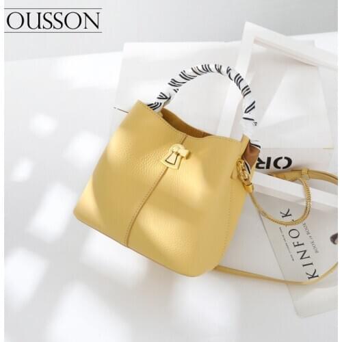 OUSSON Fashionable and versatile lightweight one-shoulder messenger cowhide yellow rotating lock bucket bag