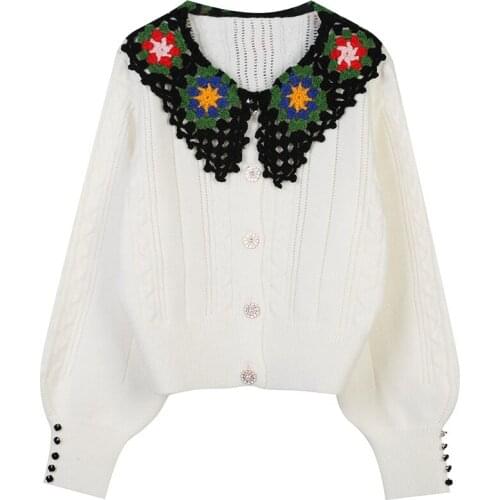 2021 Autumn New Womens Doll Collar Long Sleeve Hook Flower Hollow Out Loose White Knitted Warm Cardigan