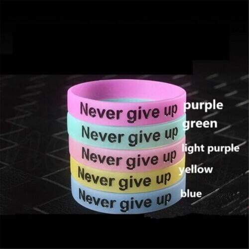 1X Never Give Up Luminous Bracelet Silicone Glow in the Dark Wristband Unisex
