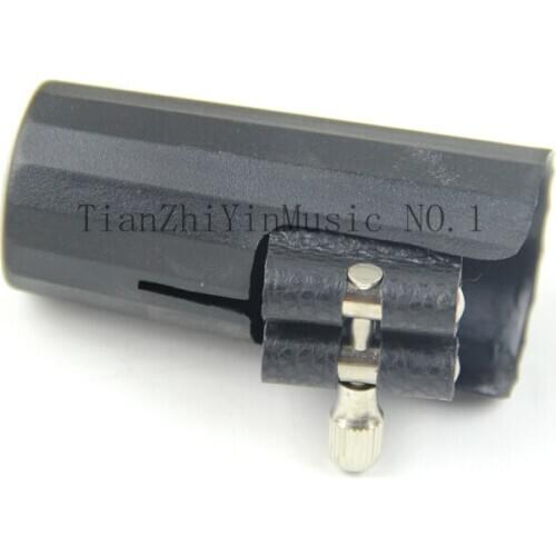 Ligature and cap for clarinet and Alto Sax parts