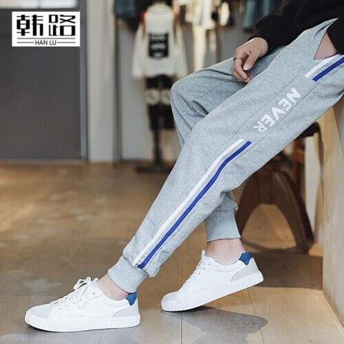 Fashion mens Sweatpants Spring autumn mens Side "never" printed stripe Pencil pants male Waist tether loose Beam foot trousers