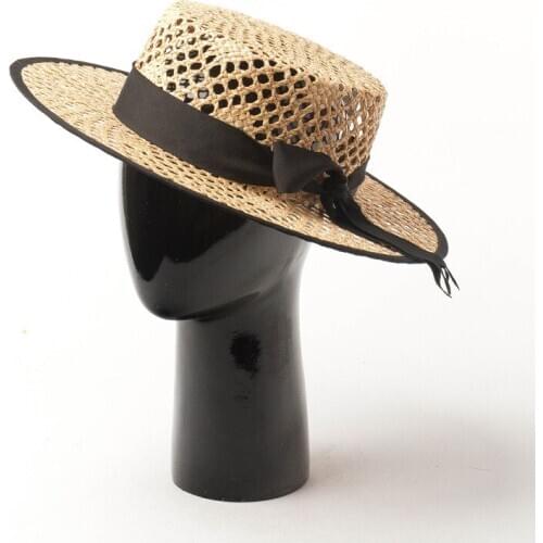 European and American spring and summer new hand-woven hollow bow decoration Lafite flat top hat sunscreen Lafite straw hat