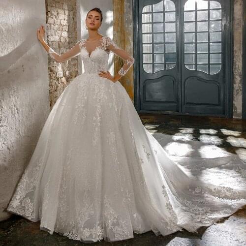 Trouwjurk Long Sleeve Wedding Dress O-Neck Luxury Robe De Mariee See Through Back Hochzeitskleid Beading Appliques Bridal Gowns