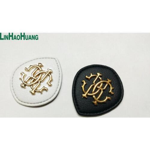 20pcs/lot black/white PU leather sew on Fashion labels with metal logo clothing label for jeans/jacket