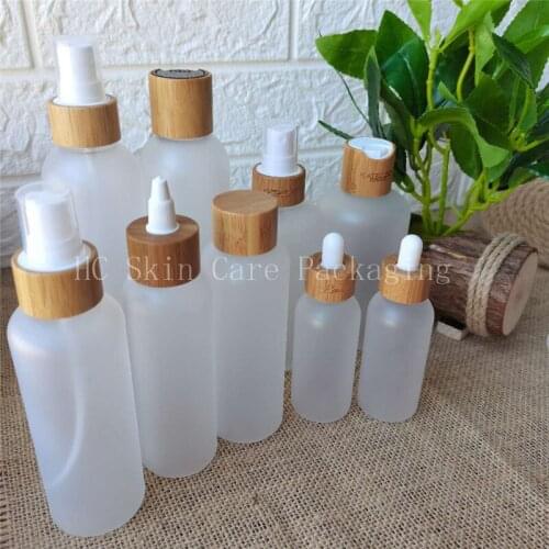 Empty cosmet 60ml 120ml 150ml 250mlml Frosted Clear PET Plastic Bottle with Bamboo Lid Plastic PET Shampo Bottle Engraving Logo