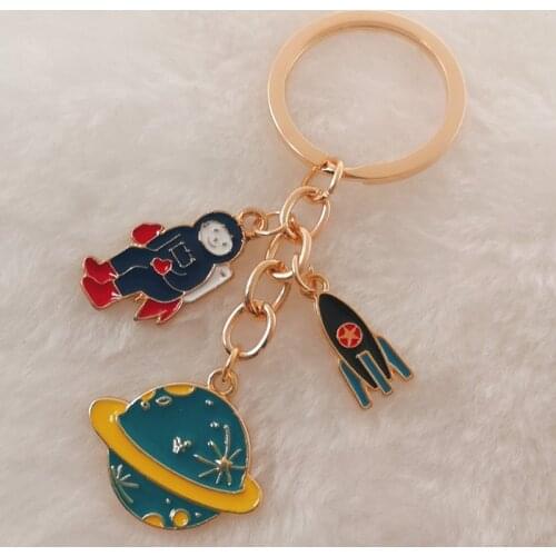 Escape from the earth ! UFO Space Craft Astronaut Rocket Planet Spaceman Universe Stars Enamel Key Ring KeyChain For astrophile