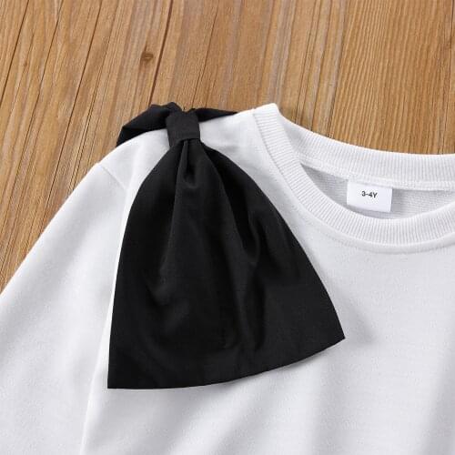 PatPat 2-piece Toddler Girl Bowknot Design White Pullover and Black Flared Pants Set