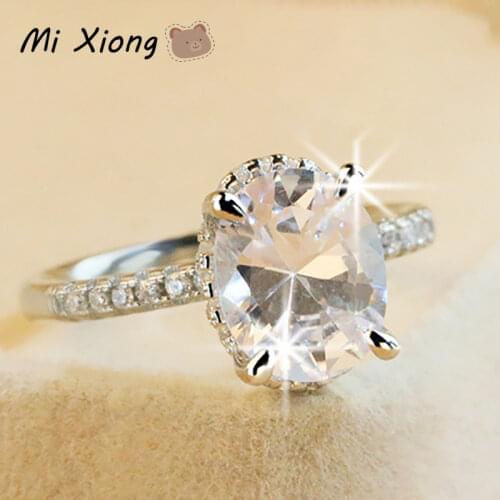Mi Xiong S925 sterling silver four-claw inlaid dove egg diamond ring shines luxury noble ladies engagement brand silver jewelry