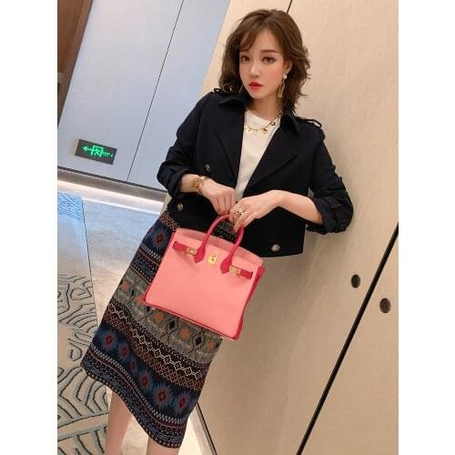 Lapel epaulette buckle short jacket + high waist bag hip jacquard step skirt suit female 2020 autumn new