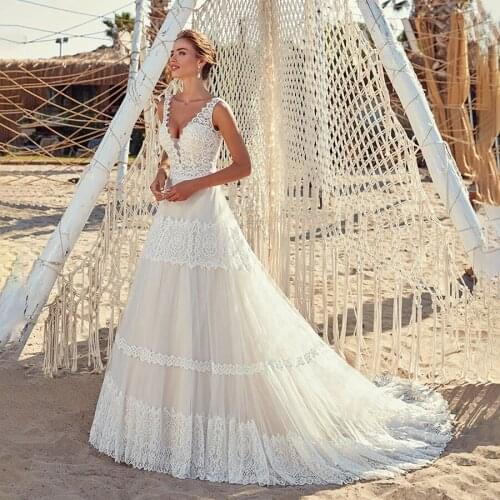 Sukienka na wesele V-neck Frace Lace Nude Tulle Wedding Dress Open Back Sexy Outside Bridal Gown with Lace Hem