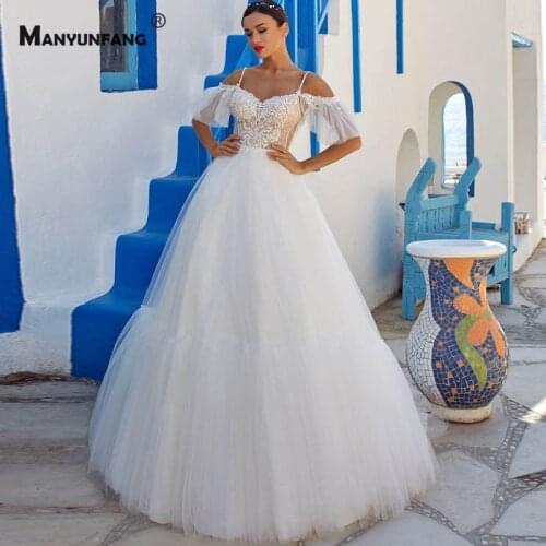 2021 New Arrival Spaghetti Straps Embroidery Appliques Tulle Bridal Ball Gown Luxury Backless Sweetheart Neck Wedding Dress