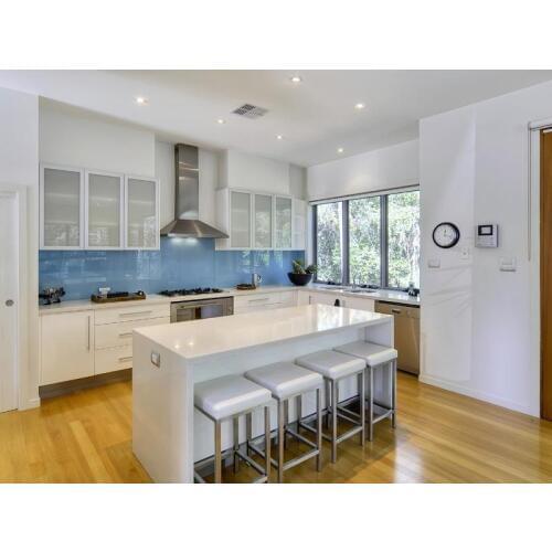 White kitchen cabinet with island for dining