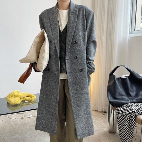 Autumn and winter womens casual solid color double-breasted pocket decoration long loose windbreaker