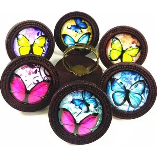 Jiangzimei 24pcs logs dark caffeine Wood cabochons with rose blue butterflies Glass cabochons finger Rings Ethnic retro-style