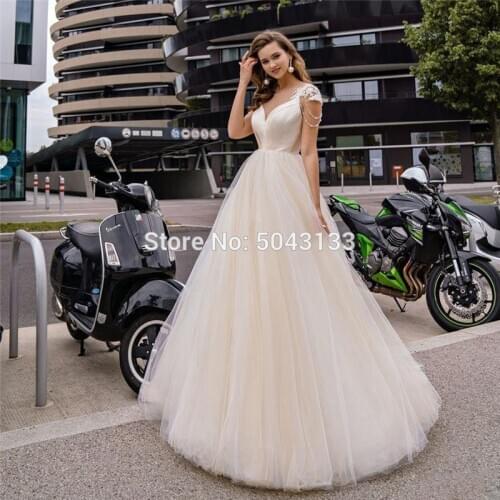 2021 Champagne A Line Wedding Dresses with Beaded Short Sleeves Sheer V Neck Soft Tulle Open Back Princess Wedding Bridal Gowns