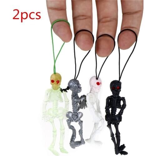 2pcs/lot Rubber scaryskull toys mini Luminous Glow In The Dark Skeleton Hanging Decoration