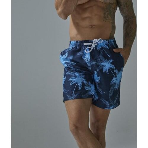 Mens Summer Solid Color Floral Print Big Pants Casual Loose Drawstring Lace Pocket Sports Beach Surfing Five-point Pants Hot