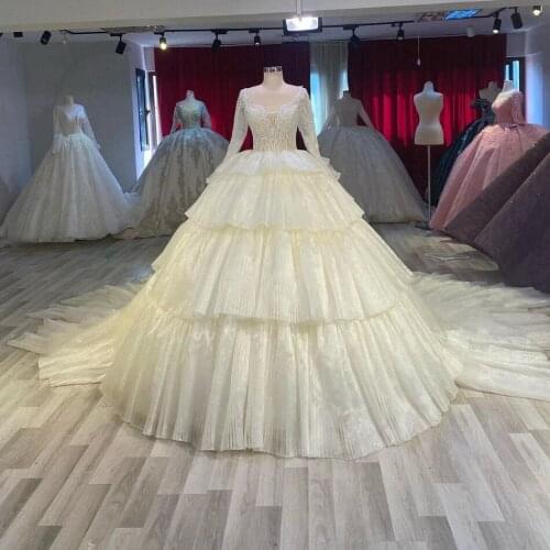 2021 New Tiered Wedding Dresses Long Sleeves Lace Appliques Sequins Glitter Pleated Bridal Wedding Gowns Custom Made