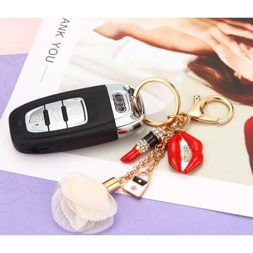 Business gift new cute red womens bag pendant key chain ring Korean cartoon birthday gift car key ring female metal pendant