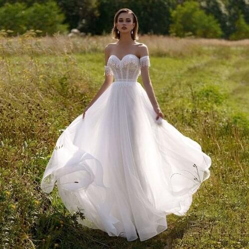 UZN Gorgeous Lace And Tulle Wedding Dress Sweetheart Sleeveless Bridal Gown Sexy A-Line Brides Dress