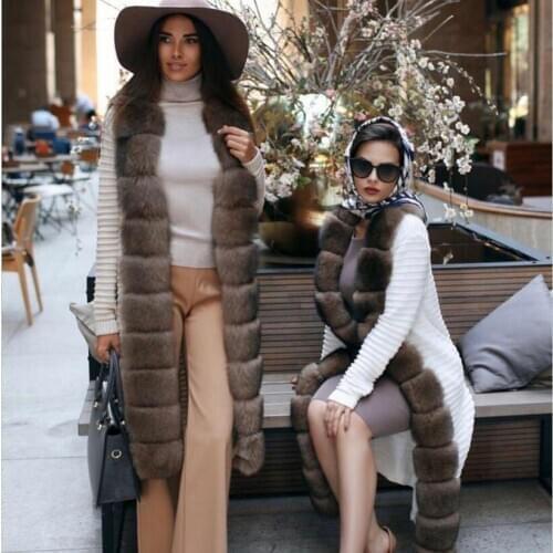 Real fur coats, knitted sweaters, real fox fur coats. Womens long extra belts. Fashion coats for autumn and winter