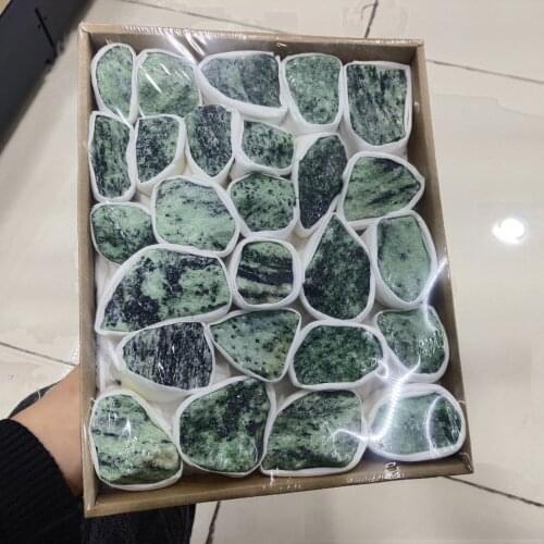 A box of Natural Red Green Treasure Raw Stone Mineral