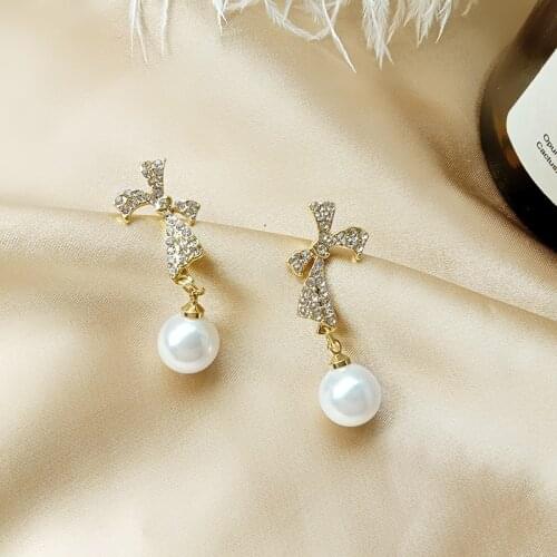 Korean Girl Earrings Fashion New Wild Bow Pearl Crystal Niche Design Net Red Temperament Earrings Womens Wholesale Sales Imanes