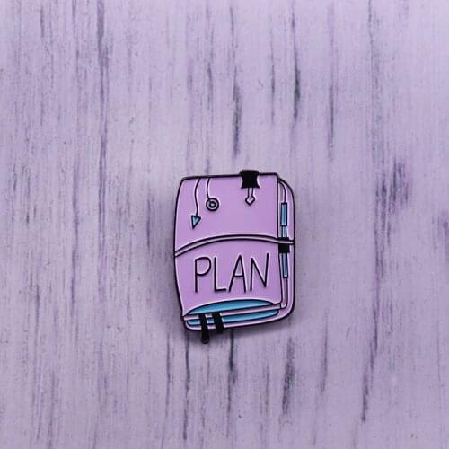 Notebook for making plans enamel pin