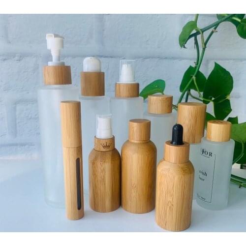 Empty cosmetic containers glass 30ml flat shoulder frosted glass bottles with different bamboo lid spray bottles