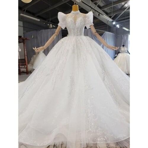 2021 Luxury Beaded Bridal Wedding Dresses Long Sleeves Ball Gown Bridal Wedding Gowns In Dubai Appliques Lace With Train