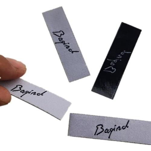 1000pcs , 1.2 * 4.5 cm Custom hot iron glue on white clothing label precut tags