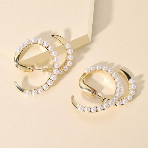 European and American personality creative imitation pearl earrings Fashion geometric spiral cross alloy earrings earrings