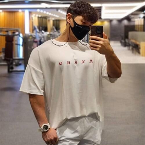 New High Quality Summer Fitness Bodybuilding Loose T-shirts Men Short Sleeve Cotton Black Tshirt Gyms Fashion Leisure Tee Top