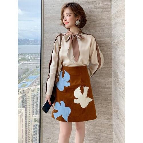 Fashion high waist slimming contrast leather patch cartoon age reducing A-line all-match skirt womens 2020 early autumn new