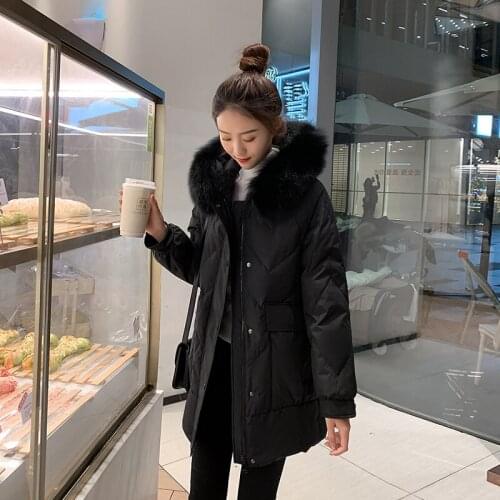 Down jacket female long winter of 2020 han edition of the new heavy hair loose more show thin white duck down jacket